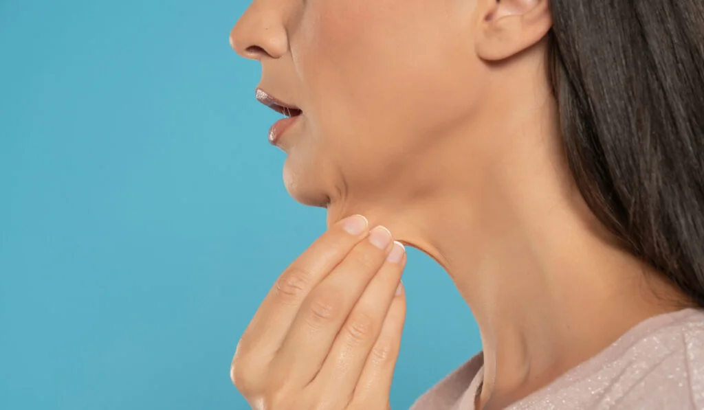 Plastic Surgeons Ozempic Face woman pulling her chin